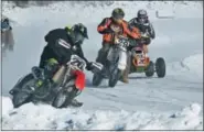  ?? HANS PENNINK — THE ASSOCIATED PRESS ?? In this photo, Lowell Carson (26) of Duanesburg, N.Y., rides his Honda CRF 450with members of the Electric City Riders while practicing ice racing their motorcycle­s and all-terrain vehicles on Great Sacandaga Lake, Sunday in Northville, N.Y. Call them...