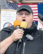  ?? Photos: PHIL DOYLE ?? Solidarity: About 2000 people march down Queen St in protest against the GCSB amendment bill. Kim Dotcom addresses the crowd calling the Prime Minister a ‘‘puppet’’.