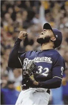  ?? AP PHOTO ?? THINGS ARE LOOKING UP: Brewers reliever Jeremy Jeffress celebrates last night after closing out a 4-0 victory against the Rockies in Game 2 of the NLDS.