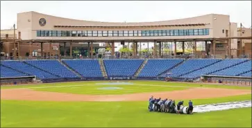  ?? Ralph Freso Getty Images ?? MAJOR LEAGUE BASEBALL is exploring completing this season by assembling all 30 teams in intended coronaviru­s-free zones at Phoenix-area ballparks, such as American Family Fields, the Brewers’ spring home.