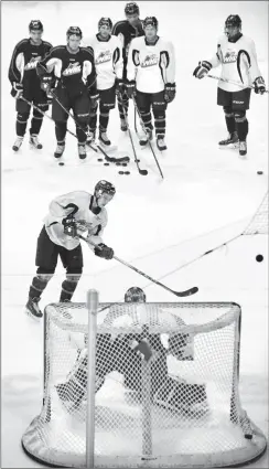  ?? Herald photo by Ian Martens ?? Brayden Burke takes a shot on goaltender Stuart Skinner as the Lethbridge Hurricanes’ practice winds down Thursday at the Enmax Centre.