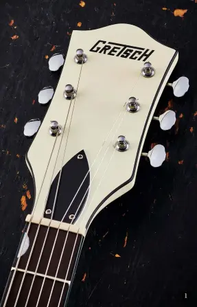  ??  ?? 1. The late-50s-style headstock features Matte Vintage White paint front and back, as well as beautiful open-back tuners 1