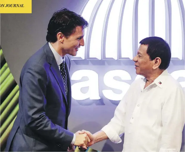  ?? MARK CRISTINO/POOL PHOTO VIA AP ?? Prime Minister Justin Trudeau shakes hands with Philippine President Rodrigo Duterte before the opening ceremony of the 31st ASEAN Summit in Manila on Monday. Duterte has invited Trudeau to a working lunch on Tuesday ahead of the ASEAN-affiliated East...