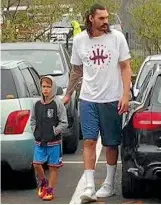  ??  ?? When this youngster got a bit overwhelme­d at the Steven Adams basketball camp, his hero came and fetched him.