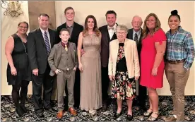  ?? ?? The Indiana Basketball Hall of Fame had a definite Decatur flavor when city native Gary Andrews was inducted on April 30. From left are, Gary's brother, Fred, and his wife, Amanda; Gary's stepson Skyler and son CJ (in front); Gary's wife, Amanda; Gary; his parents, Barb and Larry; Gary's sister, Jennifer, and her daughter, Taya, who played basketball at Indiana Tech.