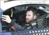  ?? Terry Renna / Associated Press ?? Corey LaJoie waits in his car during a practice at Daytona Internatio­nal Speedway last Saturday in Daytona Beach, Fla.