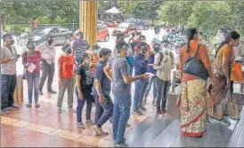  ?? PTI ?? Beneficiar­ies queue up to get vaccinated, at a hospital in Bengaluru on Tuesday.