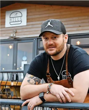 ?? GAYLE MARSH ?? Hills burger restaurant in Brecon has gained a huge following on social media. Pictured is co-owner Owain Hill