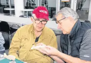  ?? LYNN CURWIN/ TRURO NEWS ?? Harold Boone, left, watches closely as Gerry Hale gives him tips on woodcarvin­g.