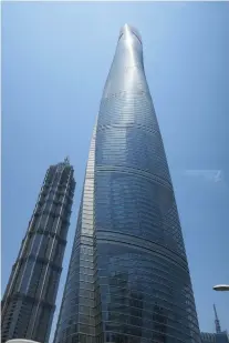 ??  ?? SHANGHAI TOWER has 128 floors. High-speed glass elevators will get you there, capable of running at 40 mph.
