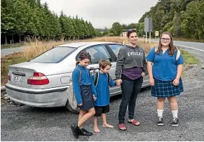  ??  ?? Amy Stuart-Forbes with son Jack, who has special learning needs, and his sisters Leilah, 8, and Sharni, 14. Stuart-Forbes says the time she has to spend driving Jack to school every day makes it difficult for her to get a regular job.