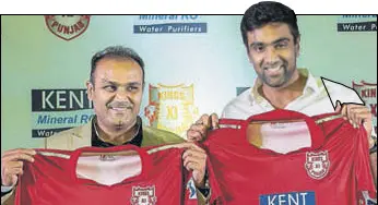  ?? PTI ?? Kings XI mentor Virender Sehwag and captain R Ashwin unveil the team jersey on Tuesday.