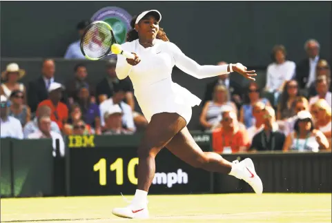  ?? Matthew Stockman / Getty Images ?? Serena Williams returns a shot against Kristina Mladenovic during their third-round match at Wimbledon on Friday.