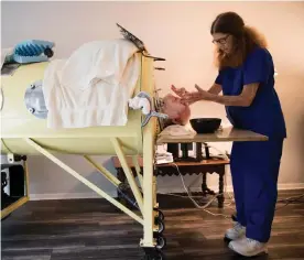  ?? Photograph: Allison Smith/The Guardian ?? Paul Alexander is given a shave while inside an iron lung in his home in Dallas, Texas.