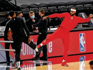  ?? Ronald Cortes / Getty Images ?? Rudy Gay, left, greets Rockets center Demarcus Cousins before Thursday’s game. Since rupturing his Achilles tendon in 2017, Gay has counseled Cousins and others who’ve suffered the same injury.