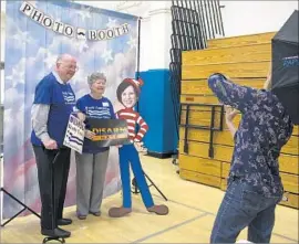  ?? Gina Ferazzi Los Angeles Times ?? CHARLES and Mary Leigh Blek of Trabuco Canyon pose with a cutout of Rep. Mimi Walters at a “town hall” meeting in Irvine that Walters refused to attend.