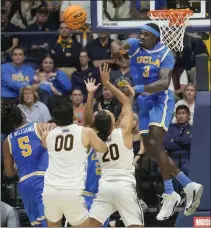  ?? JEFF CHIU — THE ASSOCIATED PRESS ?? UCLA's Adem Bona (3) blocks a shot attempt by Cal's Jaylon Tyson (20) during the second half of Saturday's Pac-12 game at
Berkeley.