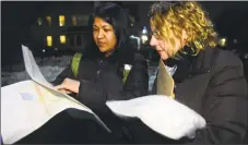  ?? Christian Abraham / Hearst Connecticu­t Media file photo ?? Volunteers Lisa Bahadosing­h and Cathy DiTuri, right, canvass in Bridgeport for the Point-in-Time homeless count in 2016.