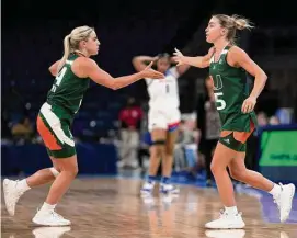  ?? Matt Dirksen/Associated Press ?? Miami guards and twin sisters, Haley and Hanna Cavinder, are shown during a game against DePaul on Nov. 20 in Chicago.