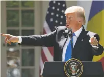  ?? ANDREW HARNIK/THE ASSOCIATED PRESS ?? President Donald Trump speaks during a news conference Friday in the Rose Garden at the White House on Washington.