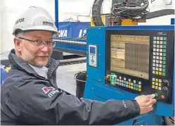  ??  ?? Top: the new Forth Drummer has entered service.
Above: project manager Mark Wilbourne presses the button to start steel cutting for the new generation of Woolwich ferries at Rementowa’s Gdansk yard.