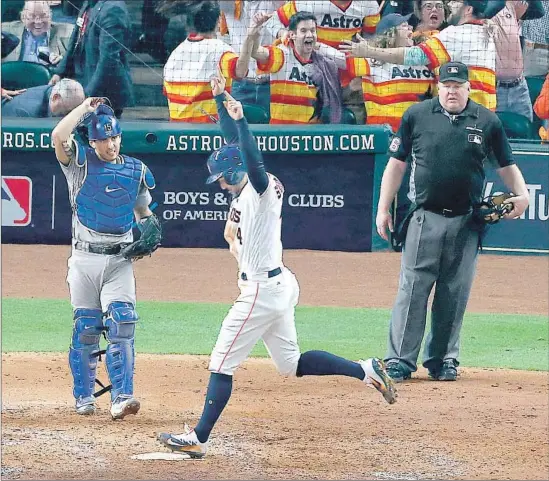  ?? Robert Gauthier Los Angeles Times ?? GEORGE SPRINGER, the eventual World Series MVP, exults as he crosses the plate on Jose Altuve’s three-run home run in the fifth inning against Kenta Maeda.