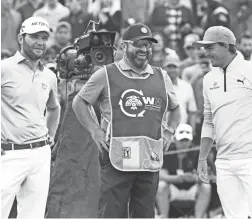  ?? ROB SCHUMACHER/THE REPUBLIC ?? Brandon Grace (center, with Rickie Fowler, right, on Saturday) turned his caddie Craig Connelly’s advice into a hole in one Friday.