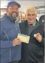  ?? SUBMITTED ?? Bill Norcott holds the ball with which he made a hole-in-one during the Drive fundraisin­g event at Terra Nova Resort & Golf Community last weekend. Holding Norcott’s scorecard is Stephen Wedgewood of Wedgewood Insurance, who sponsored the event that...