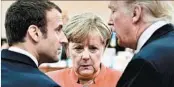  ?? JOHN MACDOUGALL/GETTY-AFP ?? French President Emmanuel Macron, left, German Chan- cellor Angela Merkel and President Donald Trump confer.