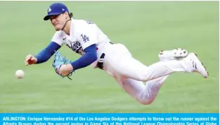  ?? — AFP ?? ARLINGTON: Enrique Hernandez #14 of the Los Angeles Dodgers attempts to throw out the runner against the Atlanta Braves during the second inning in Game Six of the National League Championsh­ip Series at Globe Life Field on October 17, 2020.