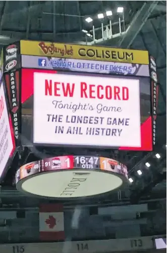  ?? THE ASSOCIATED PRESS ?? The scoreboard at Bojangles’ Coliseum in Charlotte, N.C., tells the tale early Thursday morning of the longest game in AHL hockey history, a playoff match between the Charlotte Checkers and the Lehigh Valley Phantoms. The visitors from Pennsylvan­ia won...