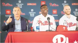  ?? MATT ROURKE/AP ?? Philadelph­ia Phillies manager Joe Girardi, left, with new players Didi Gregorius, center and Zack Wheeler during a news conference Dec. 16.