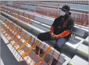  ?? ASHLEY LANDIS — THE ASSOCIATED PRESS ?? German Martinez watches the White Sox play the Giants during a spring game on Thursday in Scottsdale, Ariz. Orange netting was in place to keep fans socially distant.