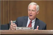  ?? GETTY IMAGES ?? Sen. Ron Johnson met with other senators on health care reform.