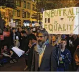  ?? KARL MONDON / BAY AREA NEWS GROUP ?? Protesters in San Francisco rally outside a Verizon store on Market Street last December, a week before the FCC’s vote on internet neutrality regulation­s. The FCC voted along party lines to end the rules.