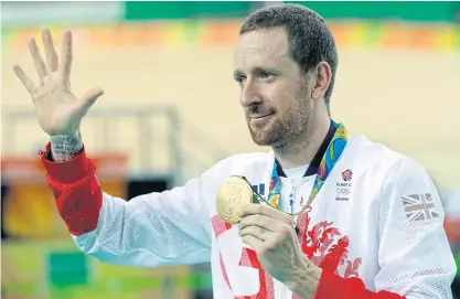  ??  ?? Bradley Wiggins of Britain poses on the podium with the team pursuit gold medal at the Rio Olympics.