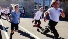  ?? ?? Daily Mile: Pupils at St Ninian’s in Stirling take part