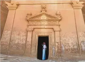  ?? REUTERS PIC ?? A Saudi tour guide standing inside a tomb at Madain Saleh, a United Nations Educationa­l, Scientific and Cultural Organisati­on World Heritage Site, in Al Ula, Saudi Arabia.