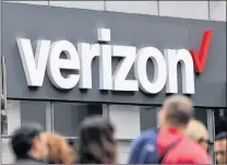  ?? AP PHOTO ?? Verizon corporate signage is captured on a store in Manhattan’s Midtown area, in New York.