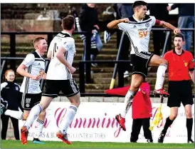  ??  ?? PERSONAL HIGH : Bell leaps for joy after netting his matchwinni­ng goal for Ayr