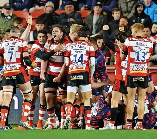  ?? ?? Gloucester players celebrate after Jack Singleton scores their fourth try at Ashton Gate