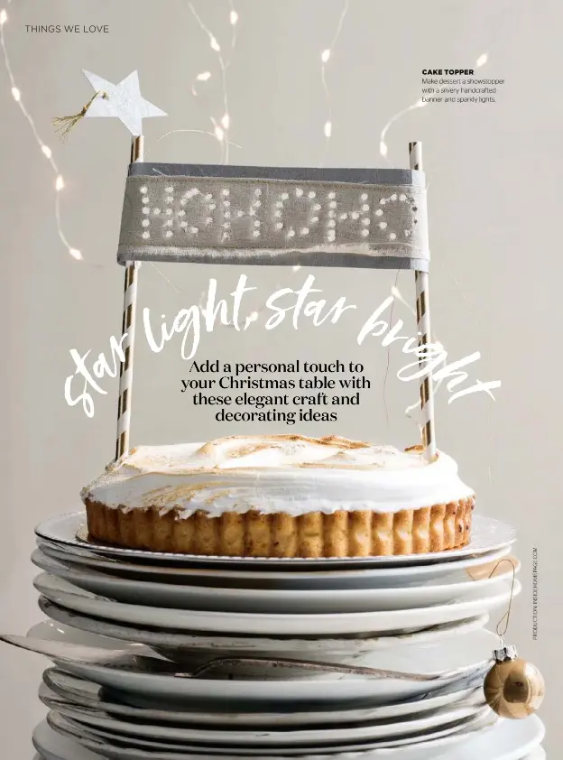  ??  ?? CAKE TOPPER Make dessert a showstoppe­r with a silvery handcrafte­d banner and sparkly lights.