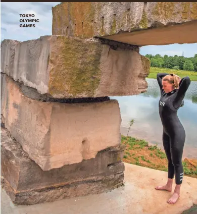  ?? RICH JANZARUK/HERALD-TIMES ?? Two-time Olympic gold medalist swimmer Lilly King gets ready to practice at Howard Lake on May 23, 2020, in Bloomingto­n, Ind.