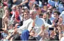  ?? ALBERTO PIZZOLI/AFP/GETTY IMAGES ?? Pope Francis greets the crowd at the end of the Palm Sunday Mass at St. Peter’s Square at the Vatican.