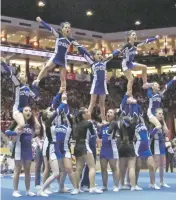  ?? WILL WEBBER/THE NEW MEXICAN ?? The final stunt in the St. Michael’s cheerleade­rs’ routine was the pyramid on Saturday in the State Spirit Championsh­ips in The Pit. It capped a solid performanc­e.