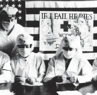  ??  ?? Fighting the epidemic: U.S. Red Cross volunteers in 1918