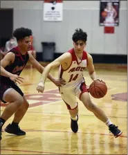  ?? PAUL DICICCO — FOR THE NEWS-HERALD ?? Perry’s Jake Cubbison drives as Chardon’s Alex Henry defends Feb. 26.