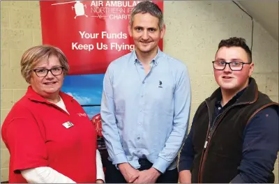  ?? ?? Ruth Collum, Air Ambulance volunteer with James Johnston, Ulster Farmers Mart and Peter Collum.