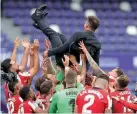  ??  ?? Respected…Diego Simeone is given the bumps by his players after their win over Real Valladolid