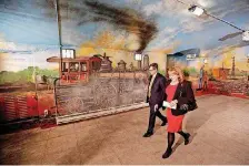  ?? [THE OKLAHOMAN ARCHIVES] ?? David Todd and Debbie Miller take a tour of the Santa Fe Station in this 2014 photo. The tunnel connection between the station and the Bricktown Canal would have been created just behind where the two are shown walking.